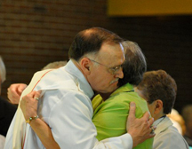 Deacons Ordinations Ed Lane Deacon Ed Lane hugs wife during the Peace