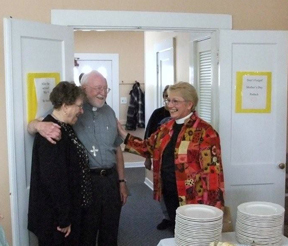 Mills and Loescher Mills speak with rector Candyce Loescher