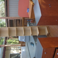 Blonde Ikea tall corner bookshelf