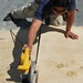 Ron works the saw