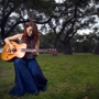 Cw_blue_dress_playing_guitar_sq_90