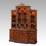 elaborate figured mahogany and finely gilt library bookcase in the Chinoiserie taste