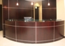 Custom reception desk with matching wall panels