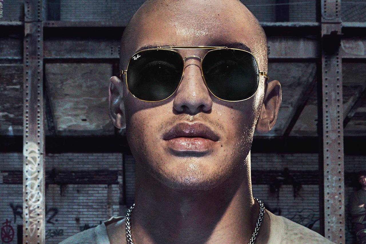 Model wearing Ray Ban sunglasses