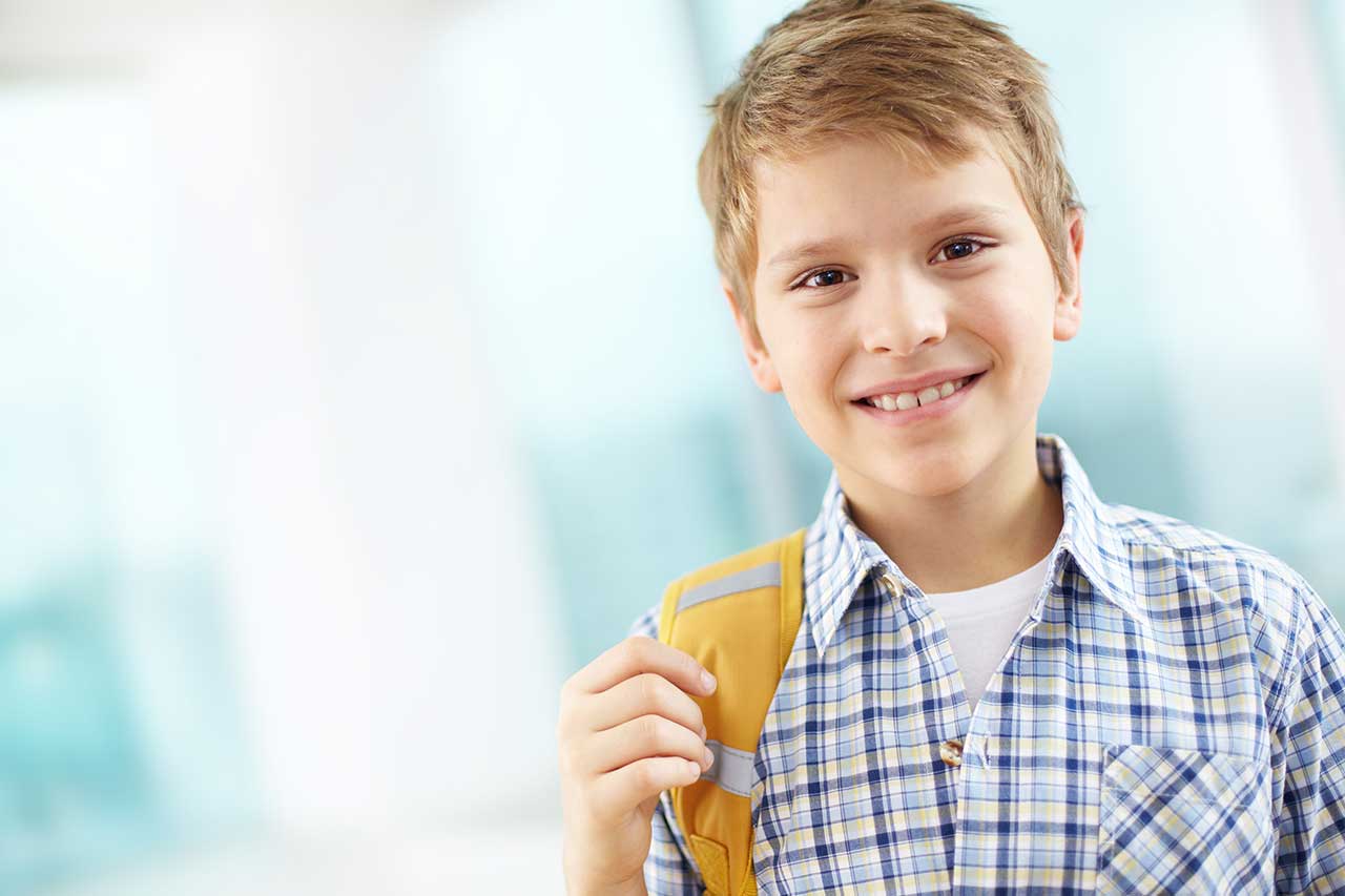 Boy on his way to school, wearing contact lenses for myopia control
