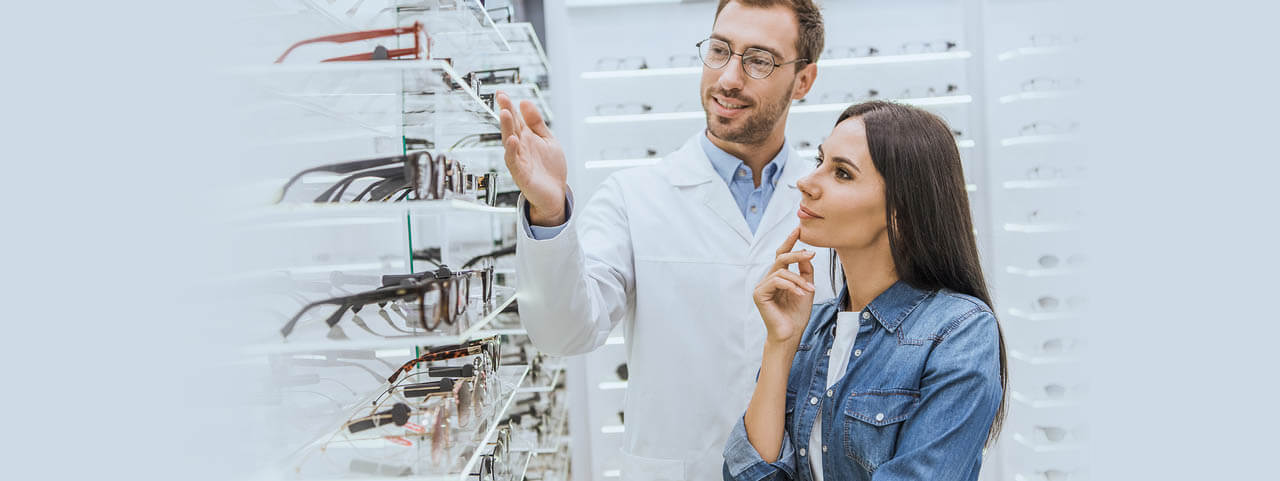 Staff Optometrist Choosing Glasses 1280x480.jpg