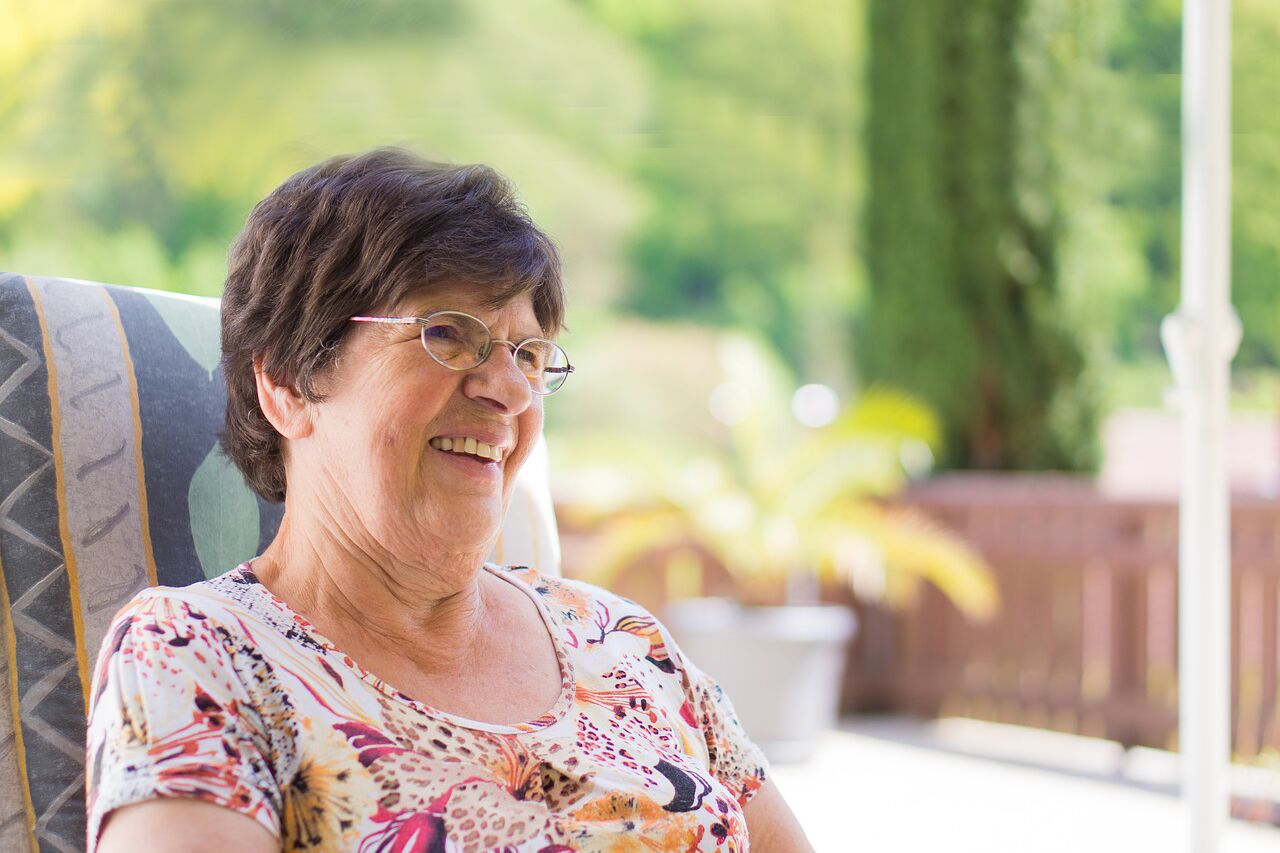 senior woman wearing glasses after CXL for keratoconus