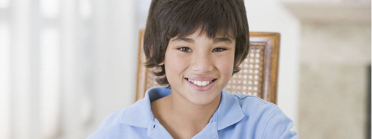 Eye doctor, little asian boy smiling in Mississauga & Brampton, ON
