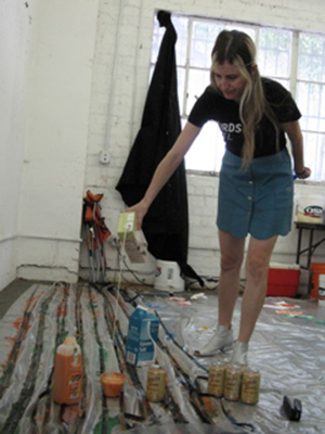 Jennifer West pouring soy milk onto filmstrips, 2010. Photo: Finn West. Jennifer West pouring soy milk onto filmstrips, 2010. Photo: Finn West.