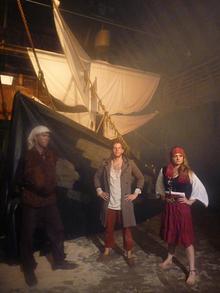 Staff in front of the ship