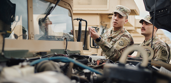alex checking the oil in his service vehicle