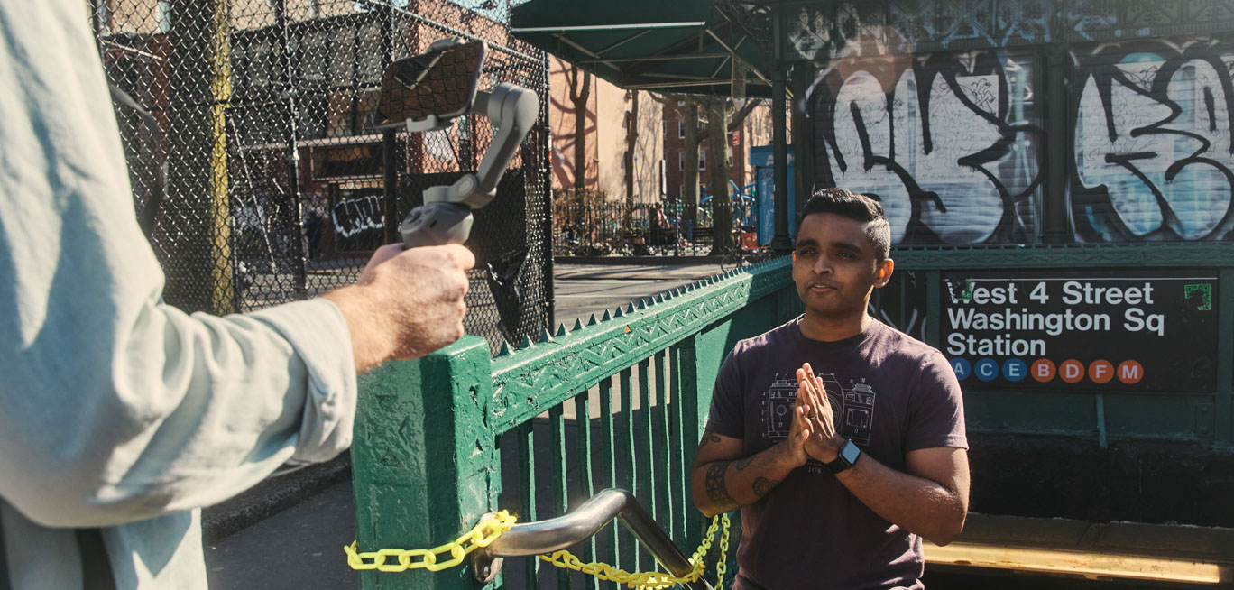 anthony stands at a subway entrance speaking to the camera
