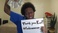 holding-a-sign_ws_1370337481