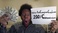holding-a-sign_ws_1361500067