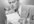 Ist2_13312096-elegant-man-talking-into-microphone-in-studio-b-w
