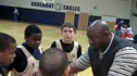 Coach Nixon talks to his team during a time-out.