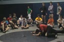 Flat on the mat tieing up arms