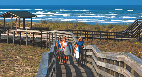 Surfers at New Smyrna Beach