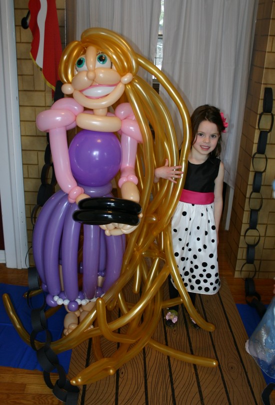 Birthday girl with her special balloon sculpture