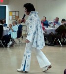 Bay Areas #1 Elvis Impersonator and Tribute Artist Rick Torres wearing the "Aqua Blue Vine" suit during Pacifica Show. Bay Areas #1 Elvis Impersonator and Tribute Artist Rick Torres wearing the "Aqua Blue Vine" suit during Pacifica Show.