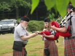 Setting up band member's pipes at the Grandfather Mountain Highland Games