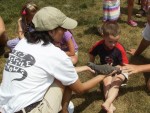 A happy b-day boy as Jeanie has him pet the exotic lizard A happy b-day boy as Jeanie has him pet the exotic lizard