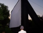 Giant 30' x 53' inflatable screen being setup