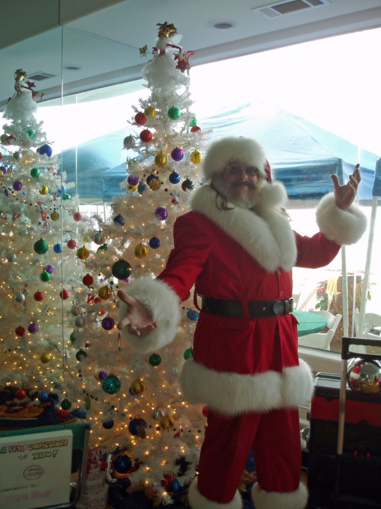 Magic Santa Claus before the white tree