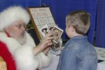 Magic Santa Claus performs Pastcards Magic Santa Claus performs Pastcards
