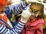 Nica painting a butterfly at a restaurant