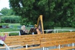 VIOLIN AND HARP DUO PERFORMING AT AN OUTDOOR CEREMONY ON LONG ISLAND VIOLIN AND HARP DUO PERFORMING AT AN OUTDOOR CEREMONY ON LONG ISLAND