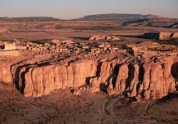 When we got to Acoma Pueblo, we waited down at the valley floor with many other visitors for a...