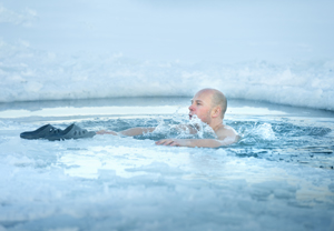 Man bathing in the ice cold water