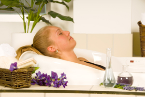 blond woman in a essential oil bath relaxing