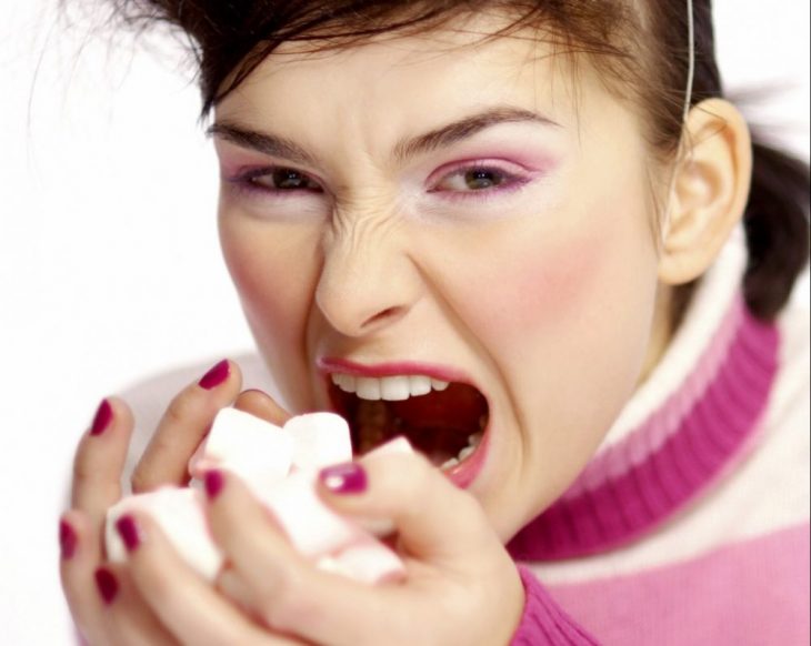 woman eating marhsmallows