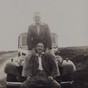 Two men on a car