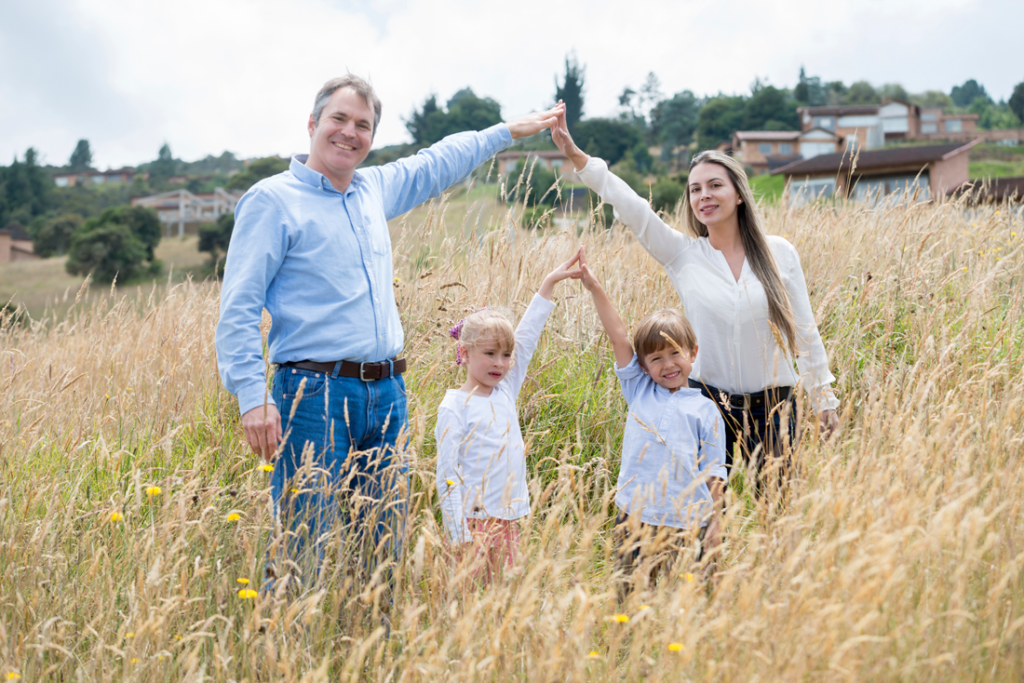 Young family of 4 on their purchased lot of land