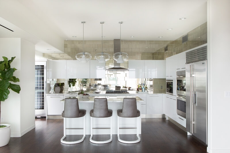 Contemporary White Kitchen with Mirrored Tile Backsplash