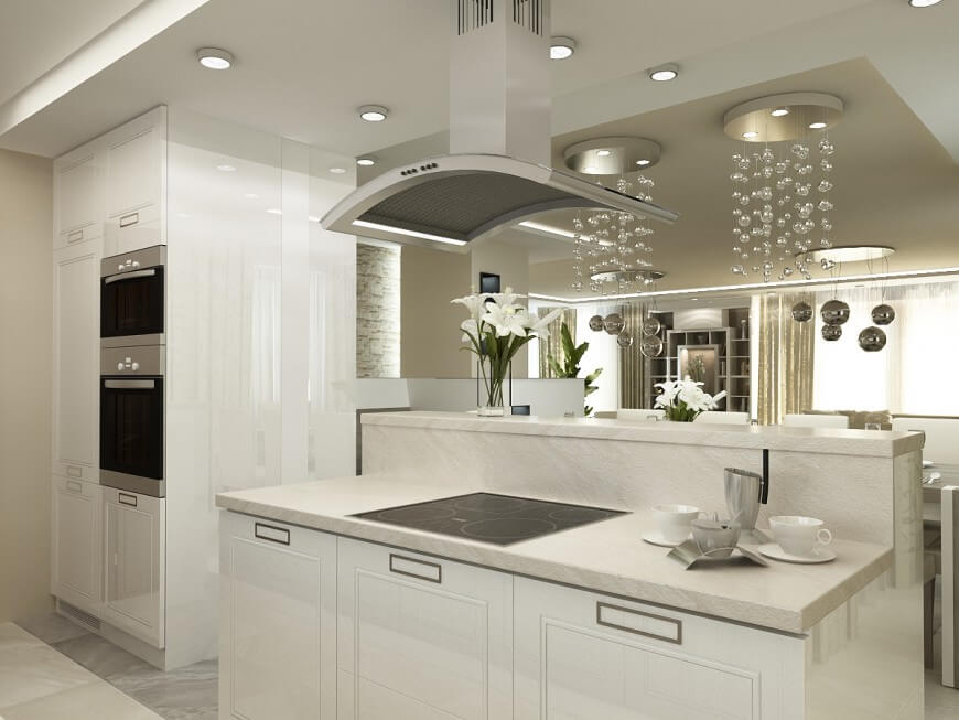 Small White Kitchen Overlooking Opulent Dining Area