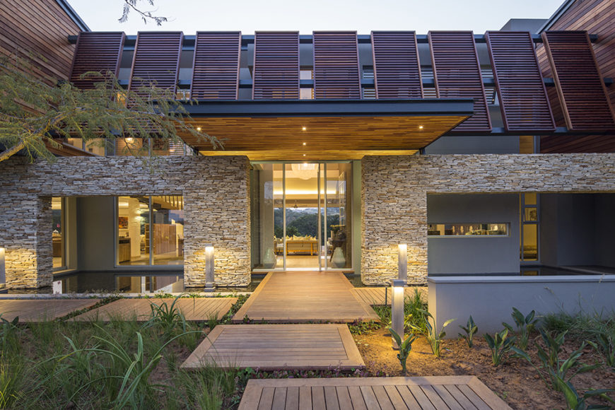 Finally, we see the approach of the front entryway. From here, the home enjoys a modicum of privacy, but also feels open and inviting.