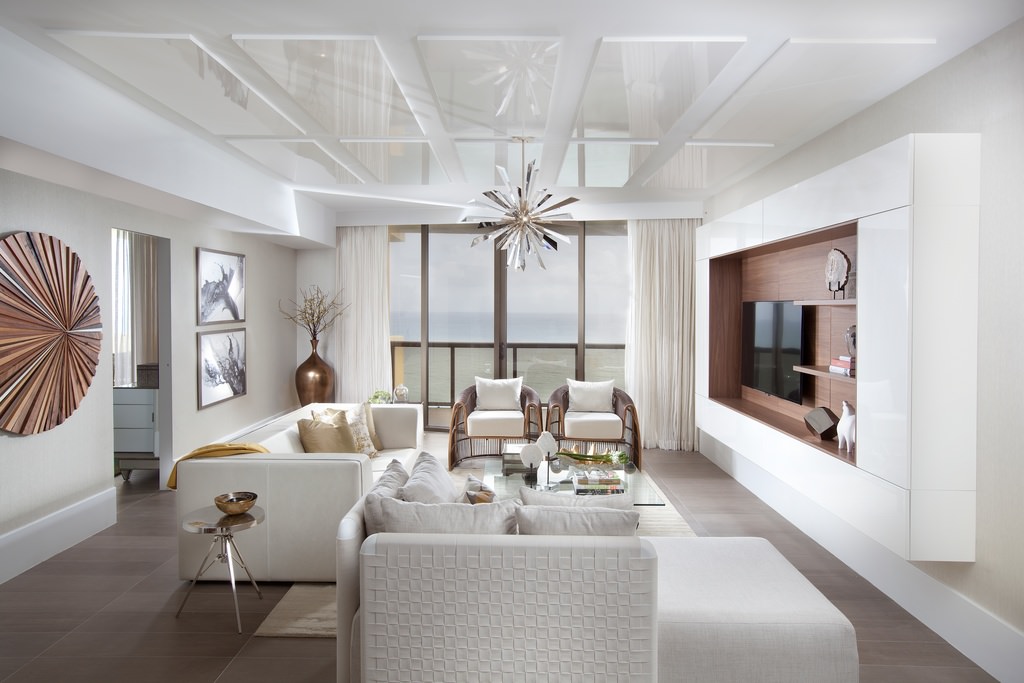 This is a sheer satisfaction of pureness and simplicity of color and design. A white sofa and pillows rest on a smooth wooden floor under the uniquely designed decors hanging on the wall and ceiling.