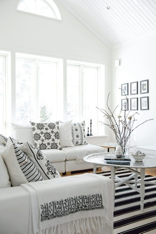 Black patterns on white creates a sleek and decorative look. This room just gleams with white and black shades.