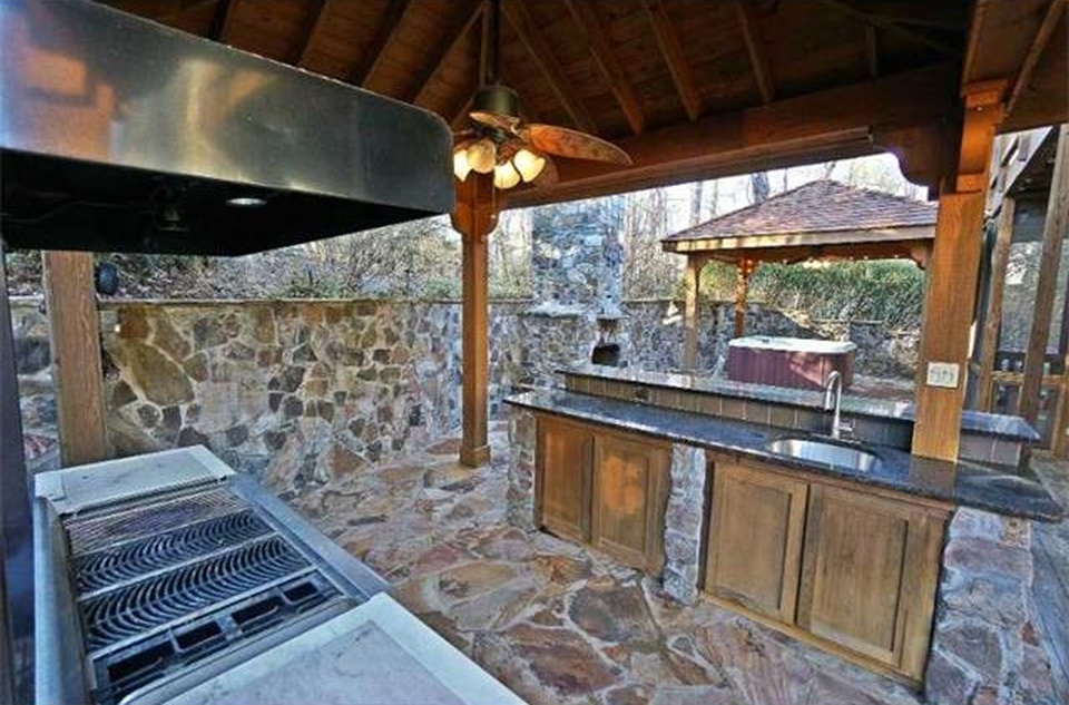 Outdoor kitchen and patio in backyard of Atlanta starter home