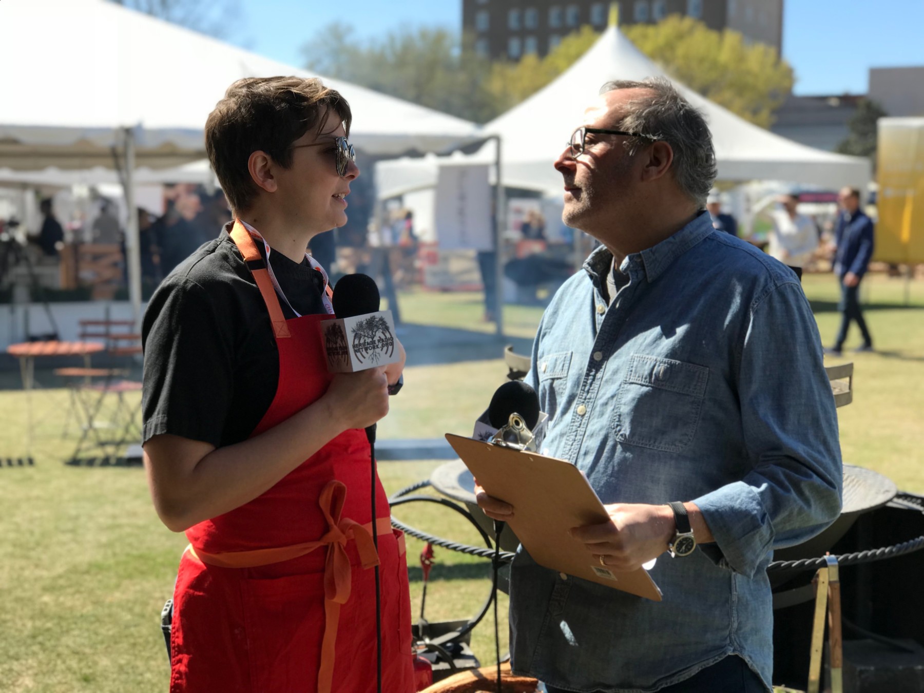 Chef Savannah Sasser talks ethical chicken with host Sam Benrubi at the Springer Mountain Farm campfire