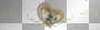 gold heart with a green diamond and gold ribbons