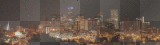 The skyline of downtown Denver with Speer Boulevard in the foreground