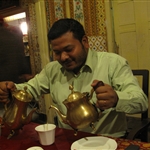 Suresh having tea and coffee - together