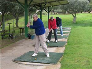 Golf lesson at the local course.