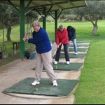 Golf lesson at the local course.