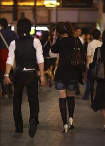 Hot chick followed by a guy!